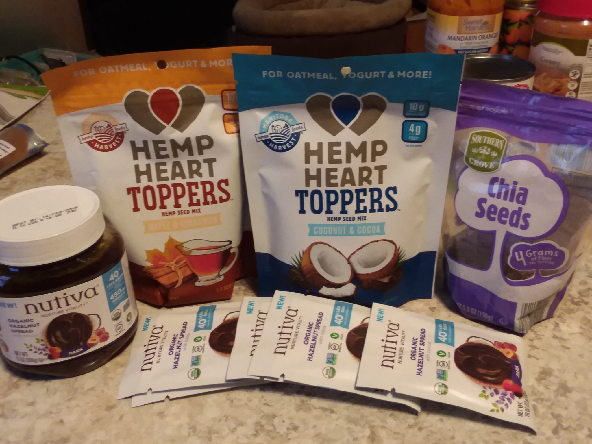 Colorful array of shelf-stable vegan protein sources like quinoa, chickpeas, and nuts arranged on camping table