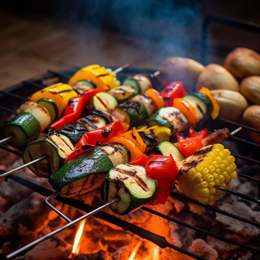 Grilled vegetable skewers over a campfire